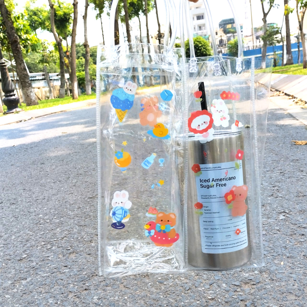 Ti nha PVC trong sut ng bnh nc c quai xch tin li tng km sticker trang tr